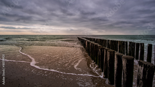 Wooden pier during cloudy weather at the beach in Vlissingen  Zeeland  Holland  Netherlands