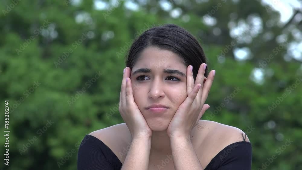 Female Hispanic Teenager Thinking And Confused Female Hispanic Teenager Thinking And Confused