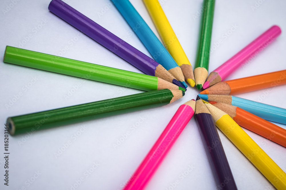 Color pens in a circular arrangement over a white background Color pens in a circular arrangement over a white background