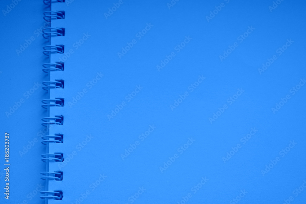 blue spiral bound notebook. Horizontal blank copybook .Template ,mock up of organizer or diary isolated.Background, texture. Notepad