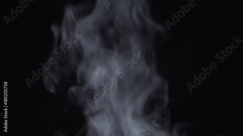 Steam rises on a black background