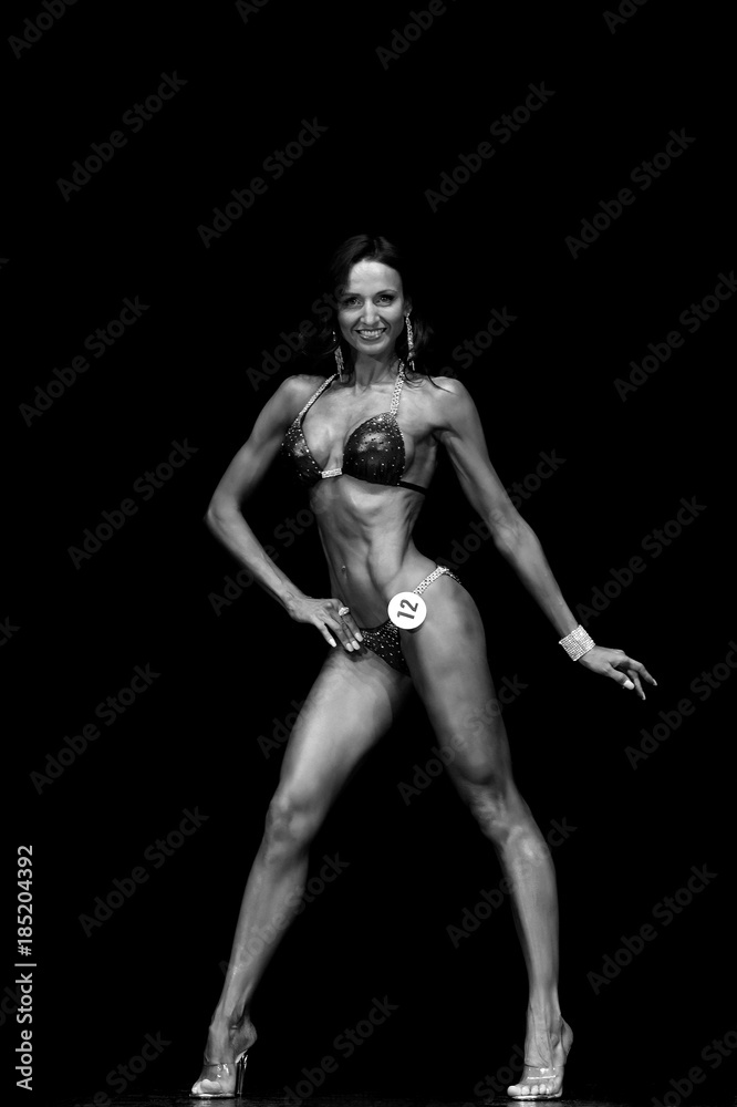 fitness model posing in competitions