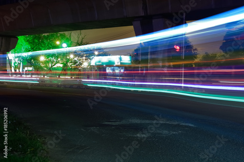 Motion traffic light trail on night of city