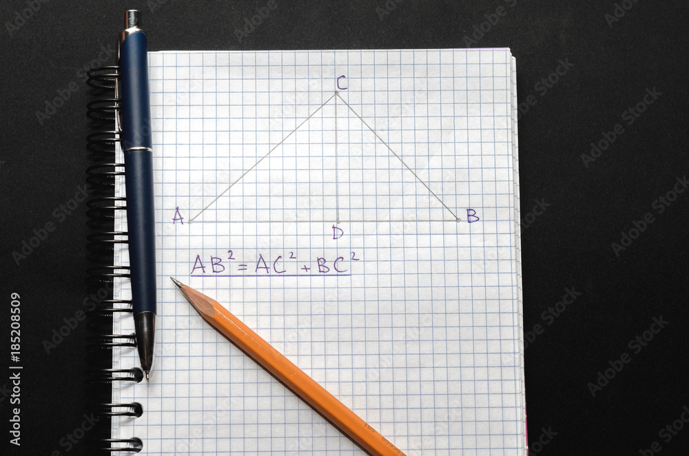 Page with formulas and the Pythagorean theorem with pen and pencil Page with formulas and the Pythagorean theorem with pen and pencil