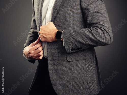 Handsome Young Man in Business Suit. Casual Style and Electronic Gadgets. Smart Watch, Business style