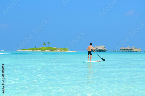 paddle board at maldives island © yongtick