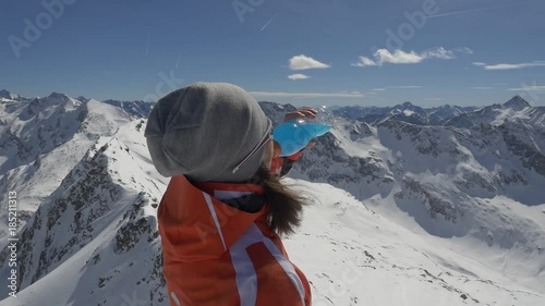 Young woman skier sportsman drinking isotonic
