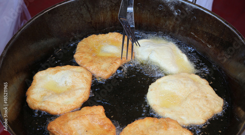 fried pancake called FRITTELLE in italian language made with apples photo