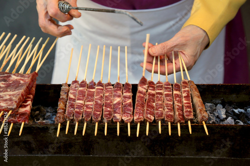 meat of lamb called Arrosticini in italian language They are a class of traditional italian cuisine of Abruzzo Region photo