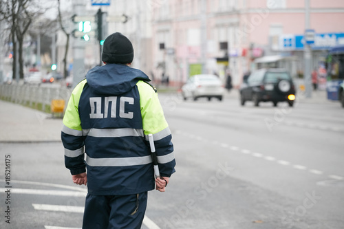 GOMEL, BELARUS - December 18, 2017: Officer of the road patrol service with a baton..