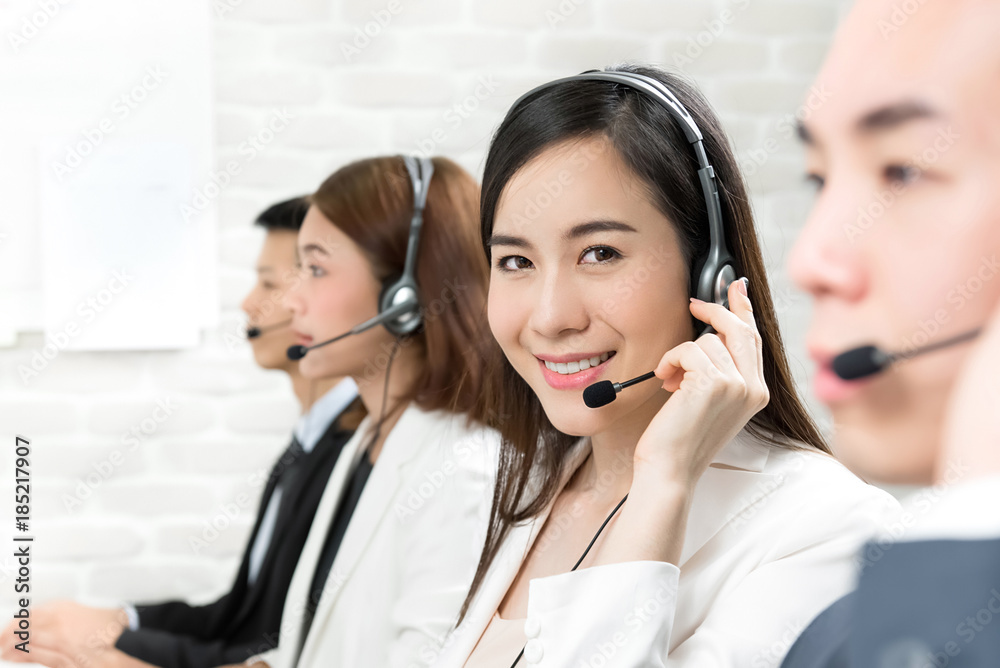 Asian telemarketing customer service agent team working in call center Asian telemarketing customer service agent team working in call center