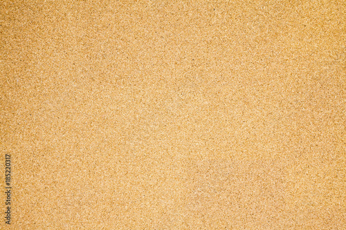 Pressed beige chipboard texture. Wooden background 