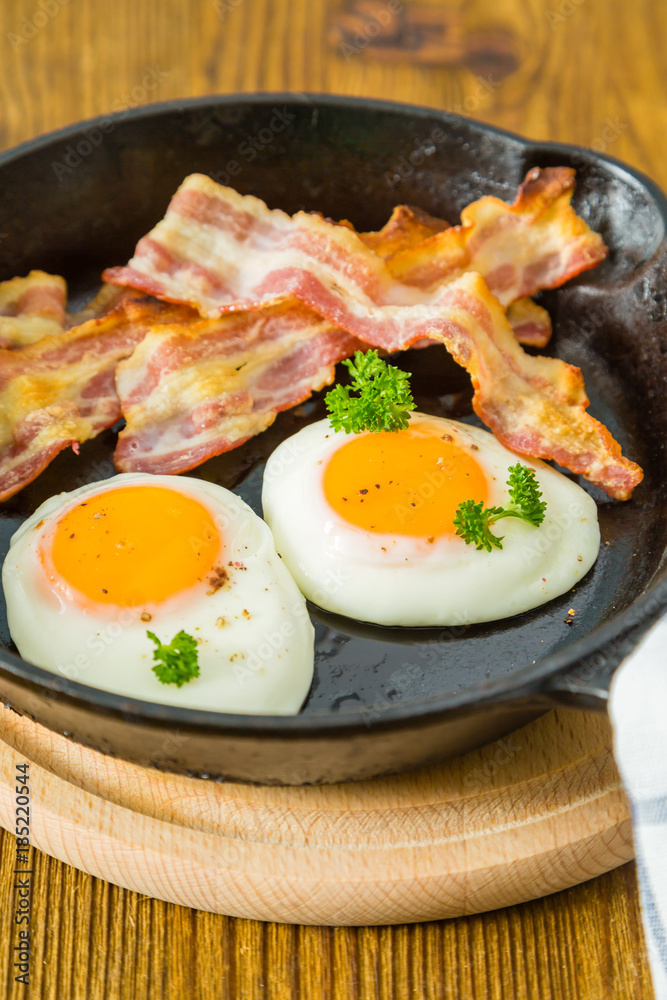 American breakfast with sunny side up eggs, bacon American breakfast with sunny side up eggs, bacon
