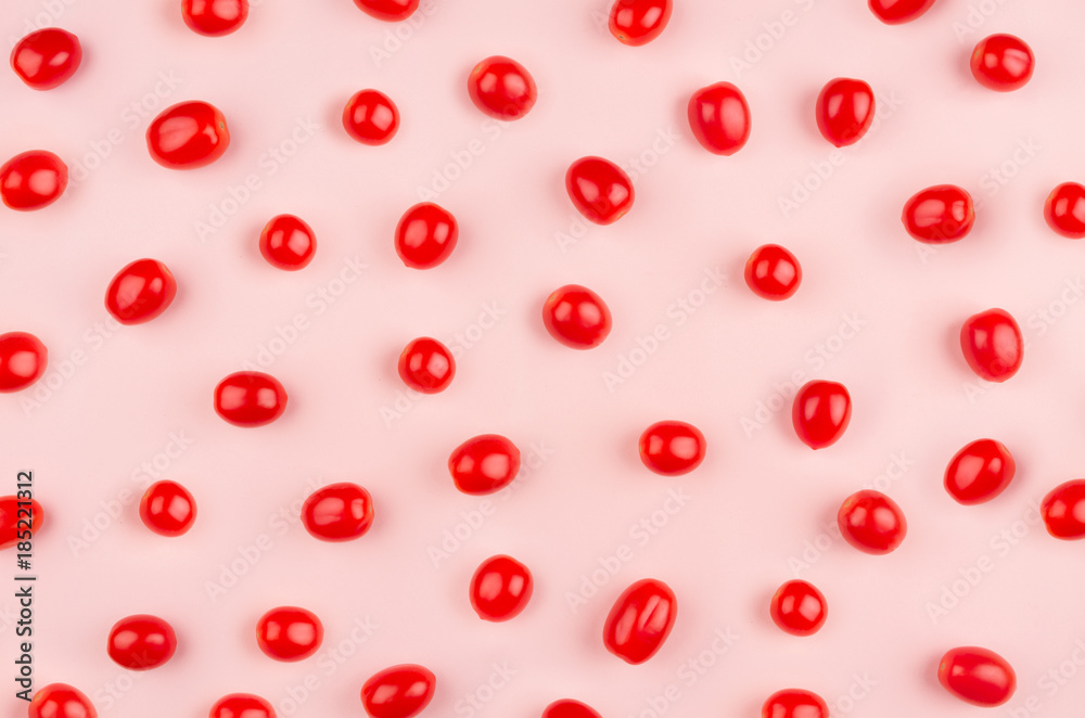 Fresh cherry tomato on soft gentle pink background, pattern, cheerful modern spring food backdrop. Fresh cherry tomato on soft gentle pink background, pattern, cheerful modern spring food backdrop.