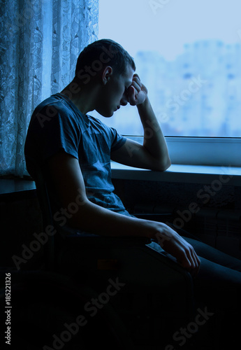 Obraz na płótnie Disabled person by window