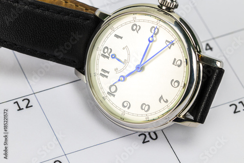 men's wrist watch and the calendar.Concept of date and time