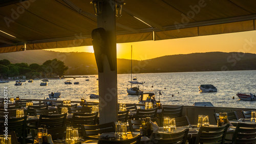 Beautiful sunset over the sea, view from restaurant photo