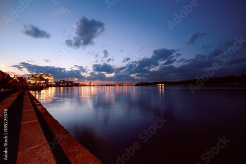 Havana bridge in Kiev at night with colorful illumination, beautiful clouds and reflection in Dnieper river. Wide angle