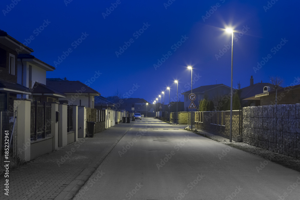 modern residential street at night wit LED street lights