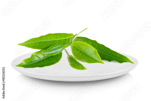 green tea leaf in white plate on white background