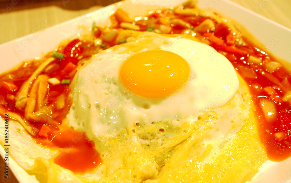 Fried Egg on rice with thai sauce,Sunny side up Fried Egg on rice with thai sauce,Sunny side up