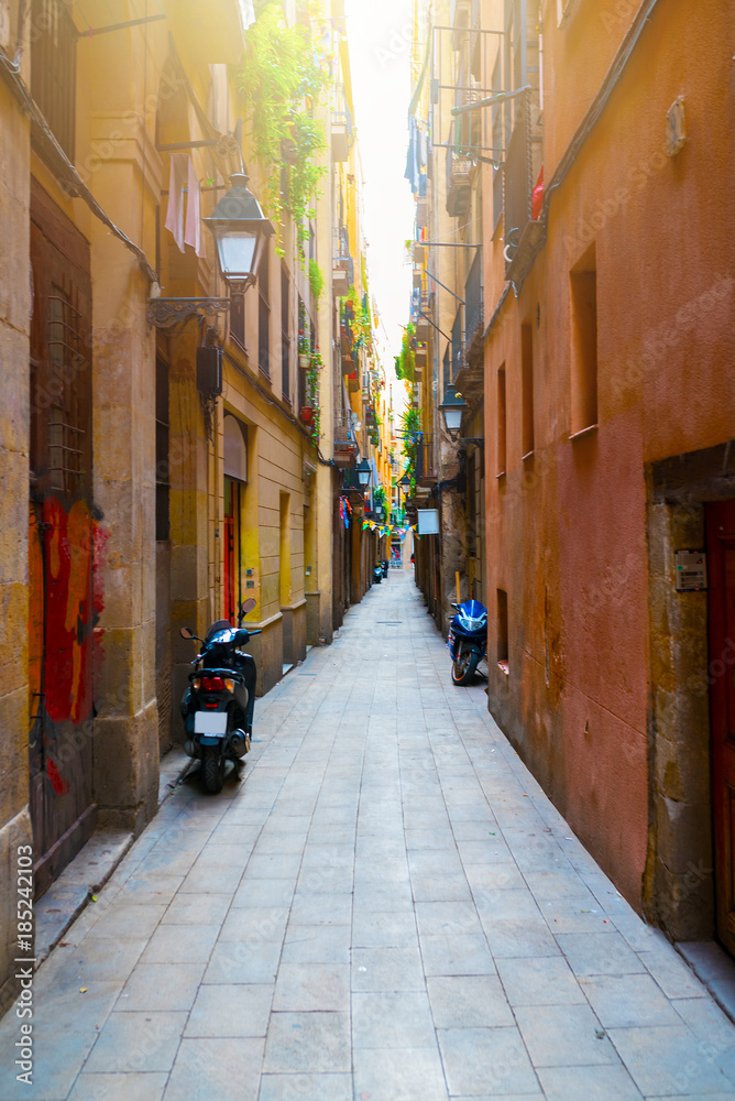 narrow alley in old town Ciutat Vella of Barcelona, Spain