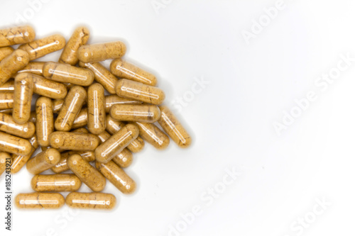 heap capsules of capsules on white background.