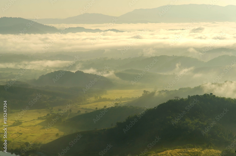 Obraz premium Landscape of mountain with the clouds and fog, Top view of the haze on the mountain, The foggy morning at the mountain.