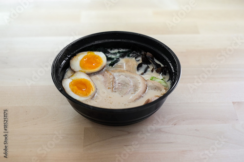 Traditional Japanese soup ramen with sliced pork and eggs