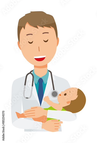 A young male doctor in a white garment holds a baby