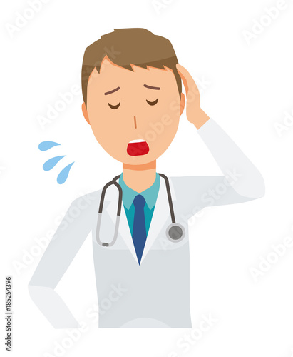 A young male doctor in a white suit is tired