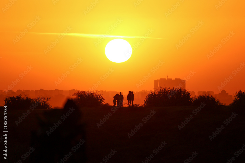 Fototapeta premium A sunset with nature and cityscape 