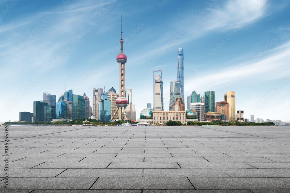 Fototapeta premium clean asphalt road with city skyline background,shanghai,china.