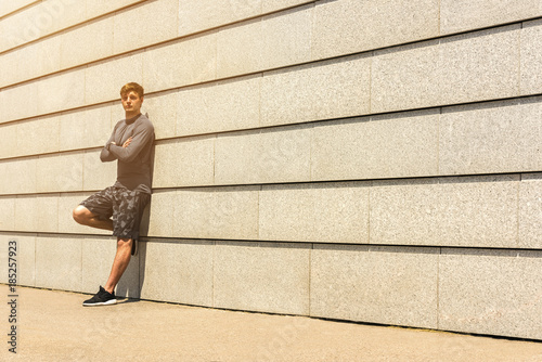 Wallpaper Mural Male jogger resting after morning run while standing against wall background with copy space area for your text message or advertising, young fit men taking break between training outdoors Torontodigital.ca