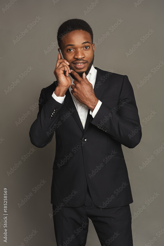 Handsome young black man portrait at studio background. Handsome young black man portrait at studio background.