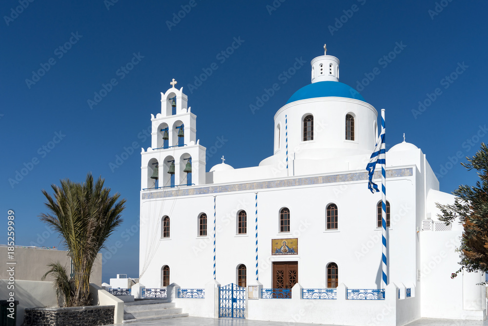 White blue orthodox church of Panagia Platsani, in the village of Oia. Santorini