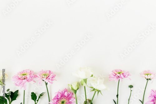 Valentine s composition with pink flowers and roses white background. Flat lay  top view.