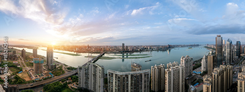 suspension bridge and modern residential district near haihe river in tianjin in blue cloud sky photo