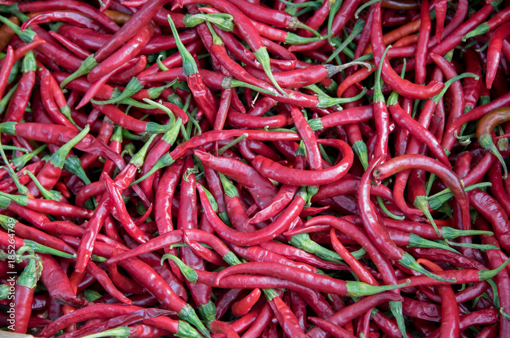 Red hot spicy healthy peppers on a fruit market