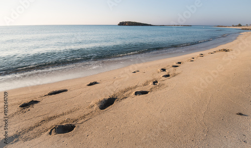 Footsteps on a sandy beach