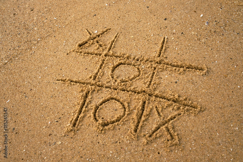 Картината върху платно tic-tac-toe drawing in sand background