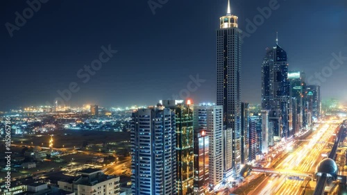 Wallpaper Mural Spectacular nighttime skyline of Dubai. UAE. Aerial view of skyscrapers, highways and metro station. 4K time lapse. Colourful travel background. Torontodigital.ca