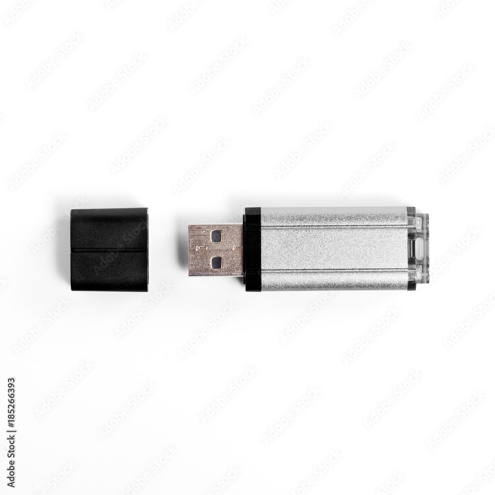 Grey usb flash drive on a white background. Grey usb flash drive on a white background.
