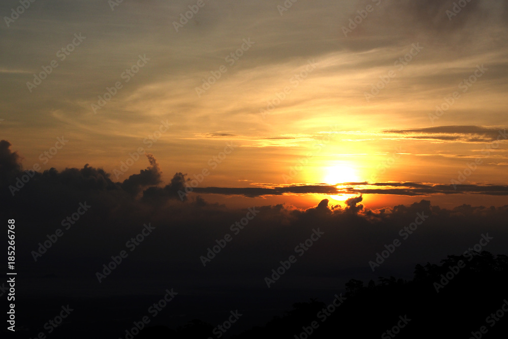 Sunrise with cloudy sky and silhouette mountains. Sunrise with cloudy sky and silhouette mountains.
