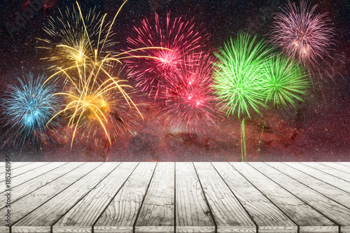 Wood top on gold bokeh with fireworks abstract background.