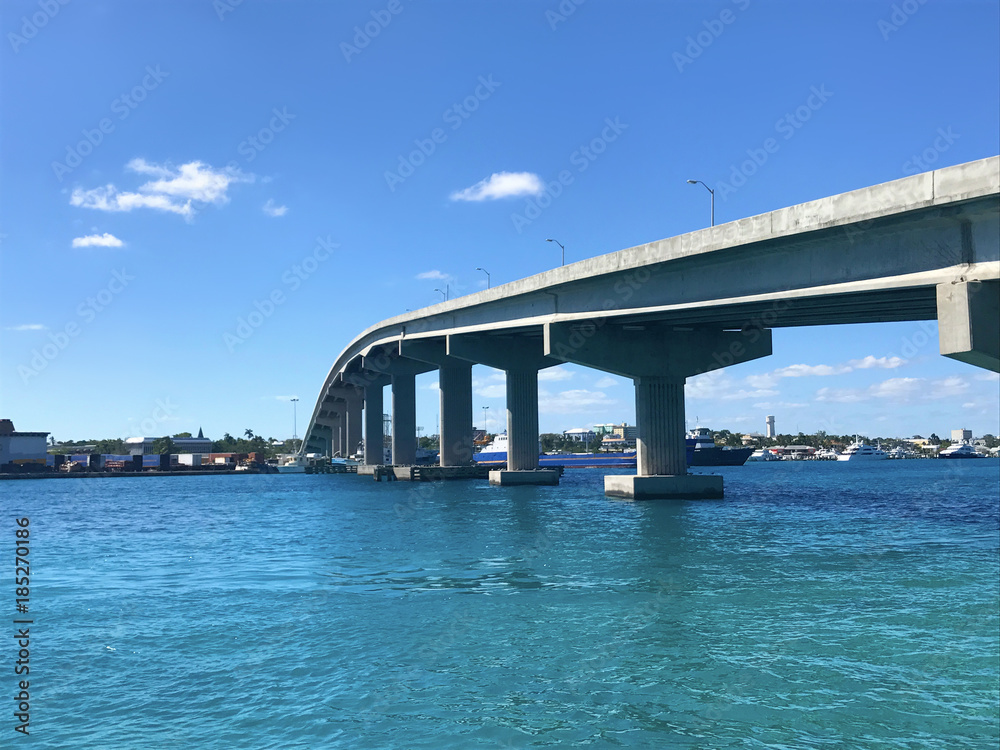 On the water in Nassau, Bahamas in the Caribbean with bridge showing port