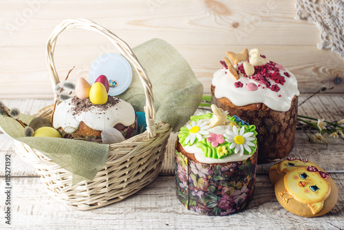 Festive table with cake and colorful eggs on wooden background. Concept of Orthodox Easter