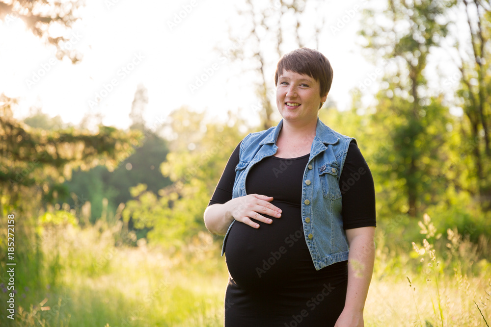 Pregnant Woman in a Field for Maternity Photos Pregnant Woman in a Field for Maternity Photos
