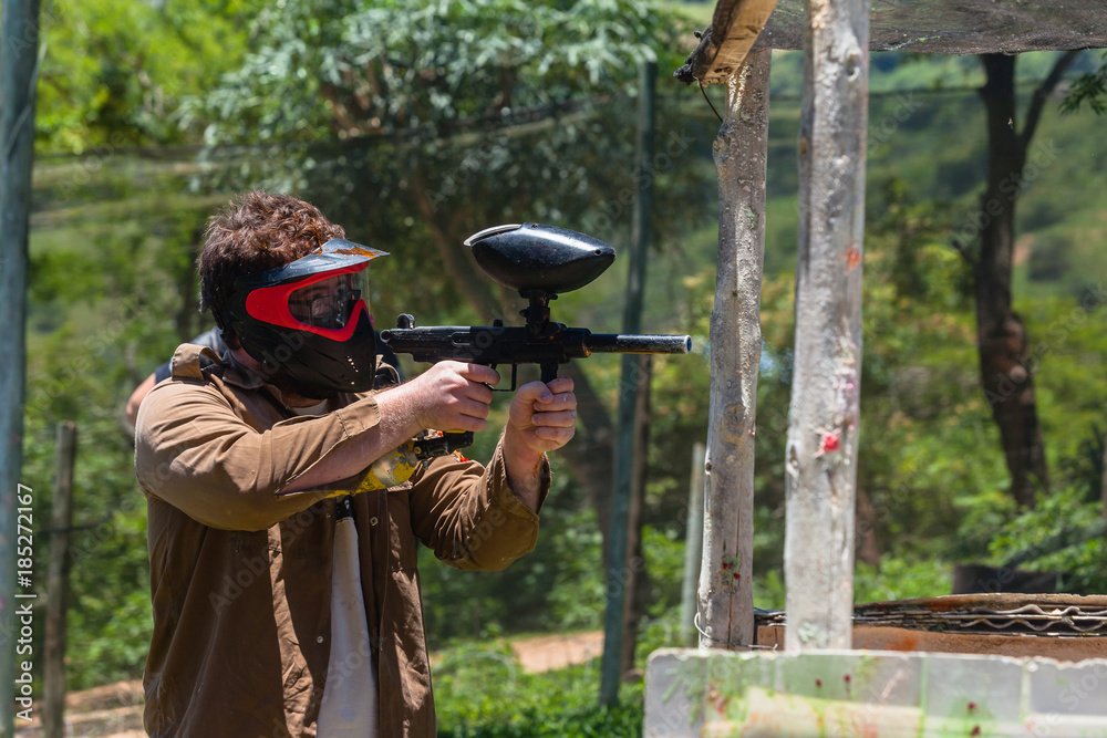 Fototapeta premium Paintball Game Player Outdoors