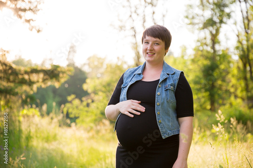 Pregnant Woman in a Field for Maternity Photos © Joshua Rainey